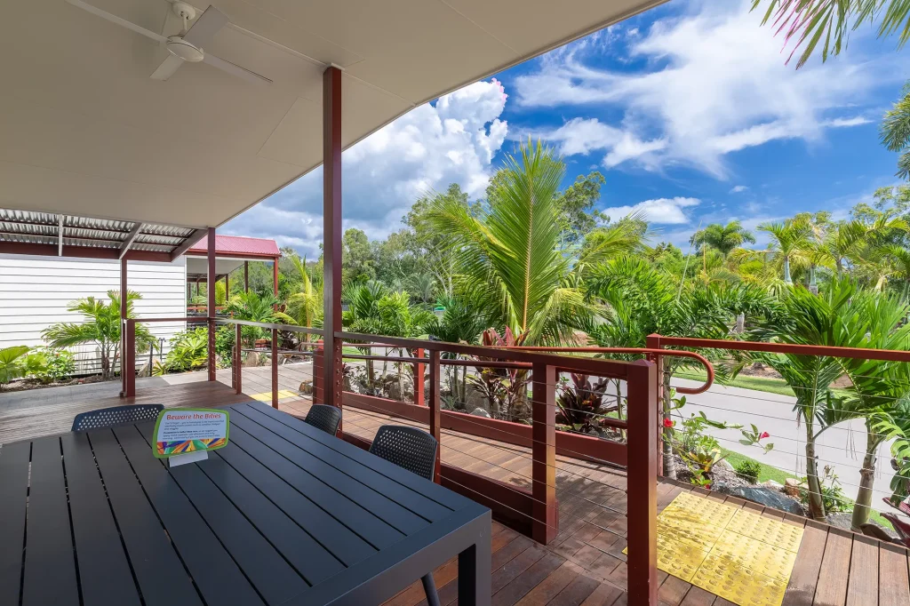 Photo shows the front balcony of a room at BIG4, featuring a ramp and wide open spaces.